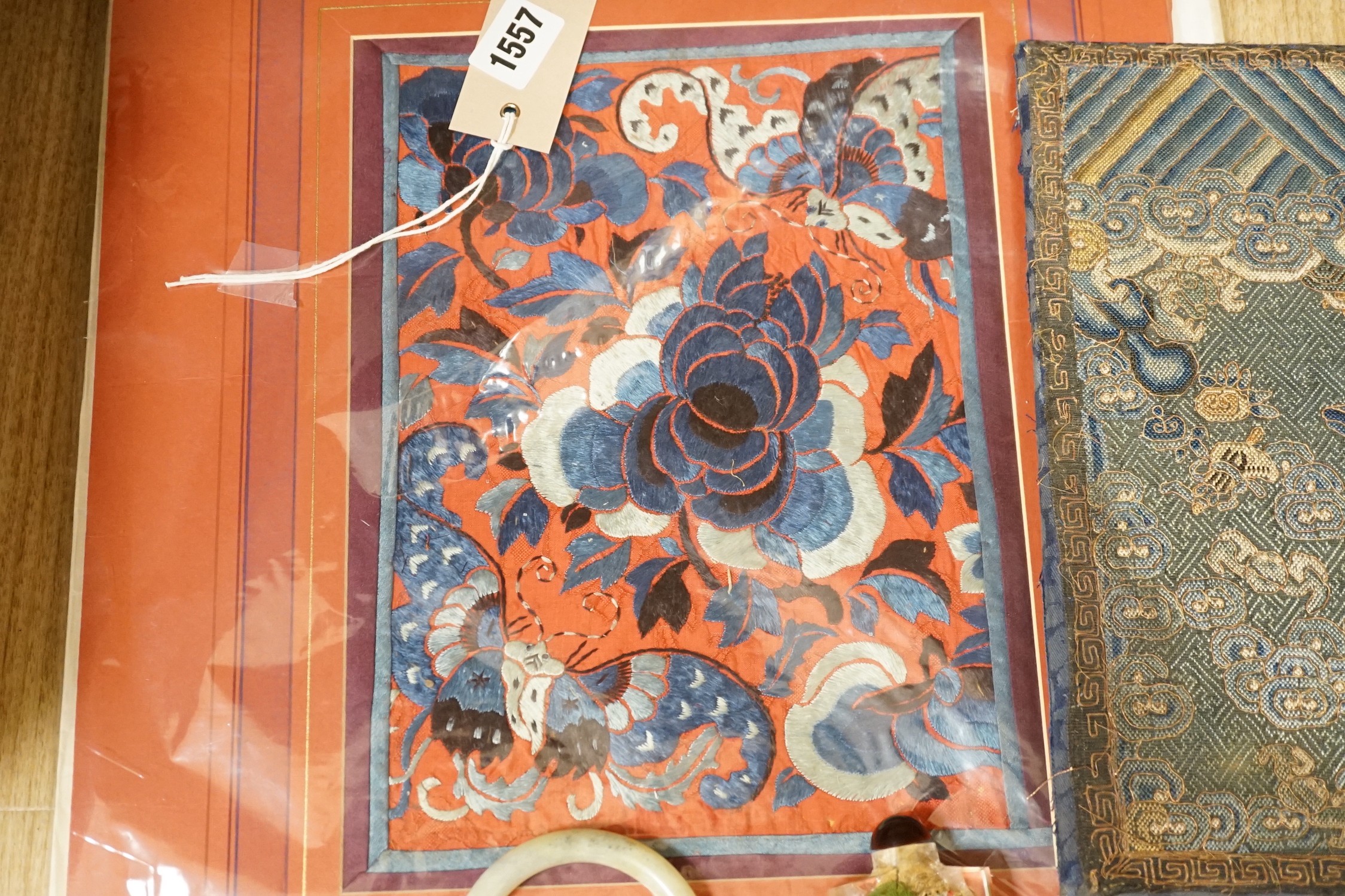 A Chinese embroidered silk Rank badge, mounted on a board, an inside painted snuff bottle, jade type bangle and a Chinese needlework pictures